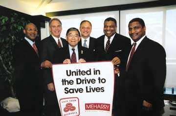 Photo, "Former Secretary Rodney E. Slater (right) joins Secretary Minetaand leaders from Meharry Medical College and State Farm Insurance at a news conference at the Press Club in Washington, DC." 