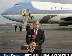 President George W. Bush delivers a statement to the media in front of Air Force One at Toledo, Ohio Express Airport, Friday, Oct. 29, 2004. White House photo by Eric Draper.