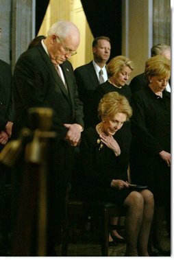 Vice President Dick Cheney, Nancy Reagan and other mourners bow their heads during the State Funeral Ceremony in the Rotunda of the U.S. Capitol Wednesday, June 9, 2004. White House photo by David Bohrer.