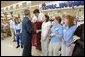 President George W. Bush greets shoppers at the Hy-Vee grocery and pharmacy store in Liberty, Mo., June 14, 2004. White House photo by Paul Morse.