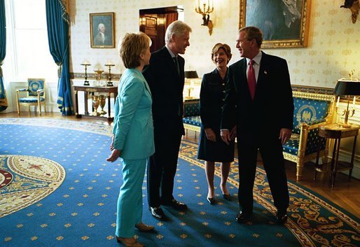 President George W. Bush and Laura Bush talk with former President Bill Clinton and Senator Hillary Clinton in the Blue Room shortly before the unveiling of the Clinton portraits in the East Room of the White House Monday, June 14, 2004. White House photo by Paul Morse.
