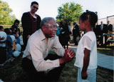Congressman Clybun with a child in Dallas