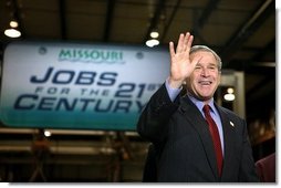 President George W. Bush acknowledges the audience shortly before participating in a conversation on the economy at SRC Automotive in Springfield, Mo., Monday, Feb. 9, 2004. White House photo by Eric Draper.