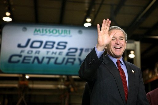 President George W. Bush acknowledges the audience shortly before participating in a conversation on the economy at SRC Automotive in Springfield, Mo., Monday, Feb. 9, 2004. White House photo by Eric Draper.