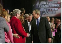 President George W. Bush greets the audience after his remarks on job training and the economy at Central Piedmont Community College in Charlotte, N.C., Monday, April 5, 2004. White House photo by Eric Draper.