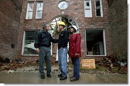 President George W. Bush comforts Scott and Annette Rector in front of their destroyed business in Pierce City, Mo., Tuesday, May 13, 2003. "You can't realize what it's like to see a tornado go right down the main street of a town and just wipe it out," said President Bush as he surveyed the damage from tornados that ripped through southwestern Missouri May 4. "It's hard to envision. But a lot of people know you're suffering, and a lot of people are praying for you, and a lot of people care for you. And a lot of people wish you all the best." White House photo by Susan Sterner.