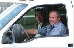 President George W. Bush and Japanese Prime Minister Junichiro Koizumi begin a tour of the President's ranch near Crawford, Texas, after the Prime Minister's arrival Thursday afternoon, May 22, 2003. White House photo by Tina Hager.