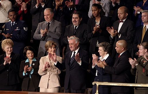 Mrs. Bush applauds her special guest, Dr. Adnan Pachachi, President of the Iraqi Governing Council, during President Bush's State of the Union Address at the U.S. Capitol Tuesday, Jan. 20, 2004. "Sir, America stands with you and the Iraqi people as you build a free and peaceful nation," said the President in his acknowledgement of Dr. Pachachi. White House photo by Paul Morse.