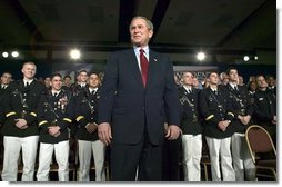 President George W. Bush stands on stage during his introduction before speaking on the war on terror at the Roswell Convention Center in Roswell, New Mexico, Thursday, Jan. 22, 2004. White House photo by Eric Draper.