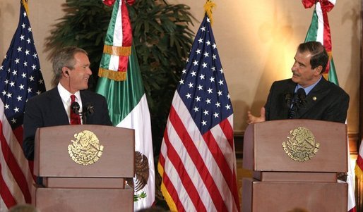 President George W. Bush and President Vicente Fox of Mexico participate in a press conference Jan. 12, 2004. "The bonds of friendship and shared values between our two nations are strong," said President Bush. "We have worked together to overcome many mutual challenges, and that work is yielding results." White House photo by Paul Morse.