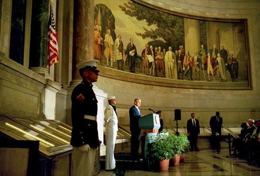President George W. Bush delivers remarks at the rededication ceremony of the National Archives Wednesday, Sept. 17, 2003. During the ceremony, the Declaration of Independence, the Constitution, and the Bill of Rights were unveiled. "In the course of two centuries, the ideals of our founding documents have defined America's purposes in the world," said the President. "Since July 4th, 1776, to this very day, Americans have seen freedom's power to overcome tyranny, to inspire hope even in times of great trial, to turn the creative gifts of men and women to the pursuits of peace." White House photo by Paul Morse.