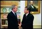 President George W. Bush and President Nicanor Duarte of Paraguay talk in the Oval Office Friday, Sept. 26, 2003. White House photo by Tina Hager.