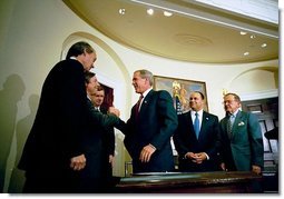 President George W. Bush signs the Do Not Call Registry in the Roosevelt Room Sept. 29, 2003. Pictured with the President are, from left, Rep. Edward Markey, D-Mass.; Rep. Fred Upton, R-Mich.; Federal Trade Commission Chairman Timothy Muris; Rep. Billy Tauzin, R-La. (behind President Bush); Federal Communications Commission Chairman Michael Powell; and Sen. Ted Stevens, R-Alaska. White House photo by Eric Draper.