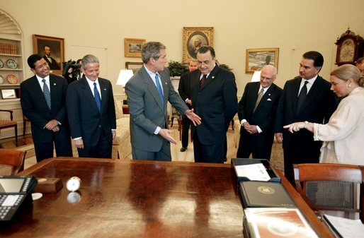 President George W. Bush explains the history of his desk during a meeting with Central American presidents in the Oval Office Thursday, April 10, 2003. From left, they are, Presidents Francisco Flores of El Salvador, Ricardo Maduro of Honduras, Abel Pacheco of Costa Rica, Enrique Bolanos of Nicaragua, and Alfonso Portillo of Guatemala. White House photo by Paul Morse.