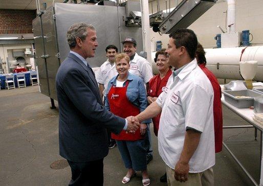 President George W. Bush greets employees of Andrea Foods in Orange, N.J., Monday, June 16, 2003. White House photo by Eric Draper.