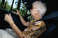 Image of older adult driving