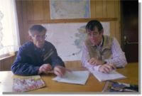 Ronald Wilson (left), 65, describes locations where the 1946 tsunami deposited driftwood on treeless Sanak Island in the Aleutians.