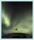 Flag at half-staff over the dome of the South Pole Station.