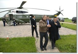 President George W. Bush escorts President Hosni Mubarak of Egypt after his arrival at the Bush Ranch in Crawford, Texas, Monday, April 12, 2004. White House photo by Eric Draper.
