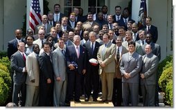 President George W. Bush with the Super Bowl Champion New England Patriots and owner Bob Kraft and coach Bill Belichick during a photo opportunity in the Rose Garden on May 10, 2004. White House photo by Paul Morse.