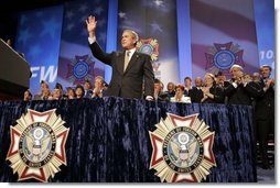 President George W. Bush reacts to the response of the audience before speaking to the Veterans of Foreign Wars convention in Cincinnati, Ohio, Monday, Aug. 16, 2004. White House photo by Paul Morse.