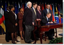 President George W. Bush signs H.R. 1298, the United States Leadership Against HIV/AIDS, Tuberculosis, and Malaria Act of 2003, at the State Department in Washington, D.C., Tuesday, May 27, 2003. The legislation commits $15 billion to fight AIDS abroad. White House photo by Tina Hager.