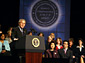 President George W. Bush addresses the Womens Entrepreneurship in the 21st Century Summit in Cleveland on Wednesday, as Secretary of Labor Elaine L. Chao (front row left) and Small Business Administration Administrator Hector V. Barreto (front row right) look on. 