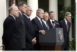 Standing with members of his national security team, President George W. Bush discusses America's intelligence reforms in the Rose Garden Monday, Aug. 2, 2004.  White House photo by Paul Morse.