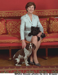 Photo of Mrs. Bush with dogs Barney and Spotty in the Red Room. White House photo by Eric Draper.