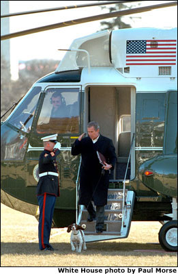 President George W. Bush and Spot disembark from Marine One on the South Lawn after spending a weekend at Camp David Feb. 11, 2001. White House photo by Paul Morse.