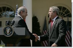 President George W. Bush shakes hands with Iraqi interim Prime Minister Ayad Allawi after their joint press conference in the Rose Garden Thursday, Sept. 23, 2004. White House photo by Paul Morse.