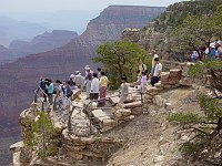 VISITORS VIEWING THE CANYON FROM YAVAPAI OBSERVATION STATION, GRAND CANYON NATIONAL PARK.