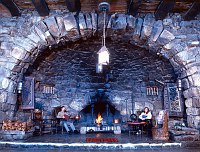 THE GREAT FIREPLACE AT HERMITS REST. CONSTRUCTED IN 1915 BY THE SANTA FE RAILROAD. DESIGNED BY MARY COLTER.