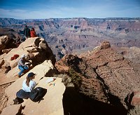 DAYHIKERS LOOKING OUT AT THE GRAND CANYON FROM OOH AAH  POINT ON THE SOUTH KAIBAB TRAIL.