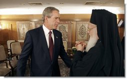 President George W. Bush talks with Ecumenical Patriarch Bartholomew I after meeting with religious leaders in Istanbul, Turkey, Sunday, June 27, 2004. White House photo by Eric Draper.