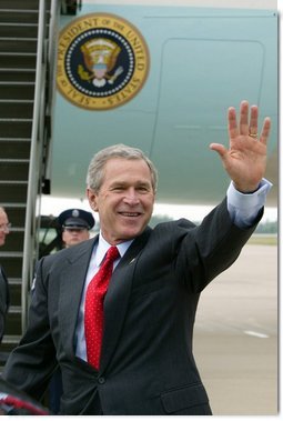 President George W. Bush waves to the crowd upon his arrival to Fort Smith, Ark., Tuesday, May 11, 2004. White House photo by Paul Morse.
