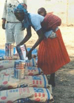 Picture of a woman and child receiving food aid.