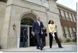 President George W. Bush and Cheryl Brown Henderson, President and CEO of Brown Foundation for Educational Equity, Excellence and Research, walk to the stage during the 50th anniversary of Brown V. Board of Education at the National Historic Site named in its honor in Topeka, Kan., Monday, May 17, 2004. White House photo by Eric Draper.
