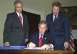 Picture of President Bush Signing the E-Government Act