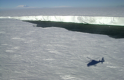 Helicopter shadow on iceberg