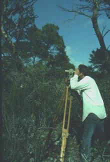 photo - Researcher conducting land survey