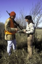 photo of hunter being assisted by a Fish and Wildlife Service employee