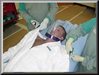 Click to begin presentation on removing clothing from a patient who may be contaminated with radioactive material.