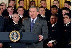 President George W. Bush speaks during the presentation of the Commander-In-Chief Trophy to the U.S. Naval Academy football team in the East Room Monday, April 19, 2004. The trophy is awarded to the Service Academy with the year's best overall record in NCAA football games versus the other academies. White House photo by Tina Hager.