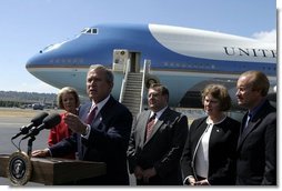 President George W. Bush talks with the media after stopping in Seattle, Wash., Friday, August 22, 2003. President Bush discussed a range of issues including his tax plan, the fires in Oregon, Iraq, and the Middle East. White House photo by Paul Morse.