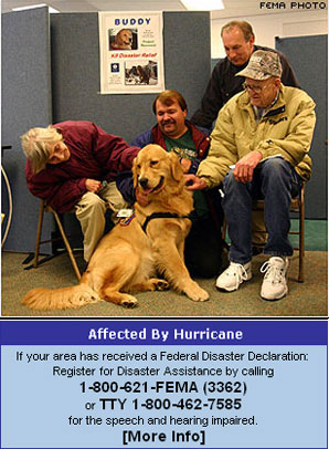 The K-9 relief canine, his handler, and visitors to the Wheeling, W. Va., Disaster Recovery Center.