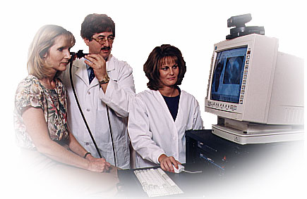 A photograph of clinicians and patients during a telemedicine consultation.