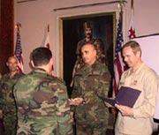 The Chief of Defense and one of the American trainers congratulate the Georgian commanders on their graduation