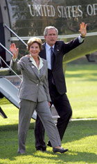 President George W. Bush and Laura Bush wave to White House staff upon arrival from Texas Tuesday, Nov. 2, 2004. - Whitehouse Photograph
