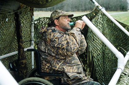 Hunter in wheel chair underneath a hunting tent at Bombay Hook NWR, Smyrna, Delaware, Credit Steve Farrel USFWS